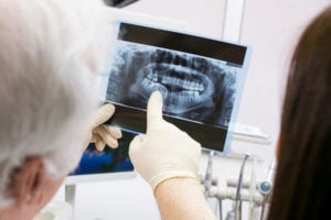 Doctor showing patient her Dental Xray